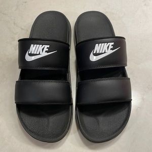 Size 10 women’s Nike Offcourt Duo Slides. Black with white logo